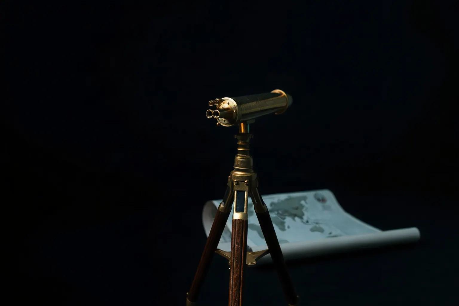 A brass telescope on a tripod pointed out of a dark window over a rolled chart — illustration for Google Search Console für Shopify